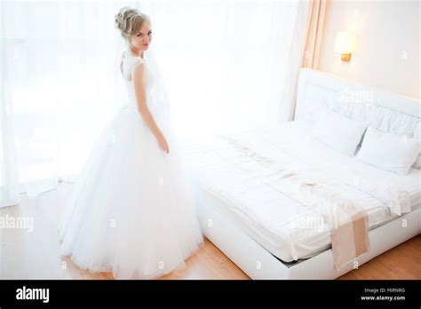 Gentle Blonde Bride On Couch Tenderly Posed Stock Photo Alamy