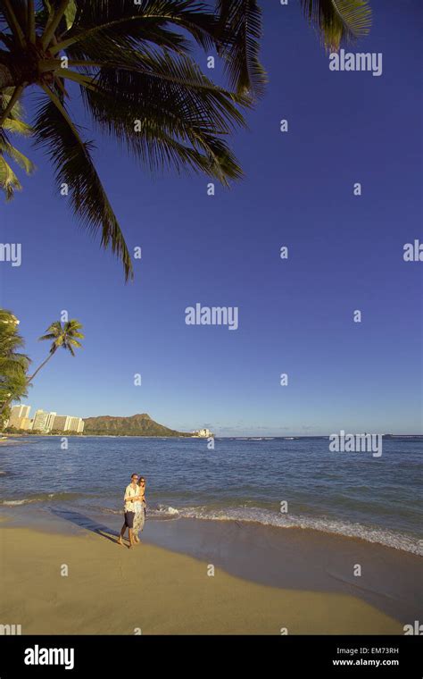 Hawaii Oahu Waikiki Beach Couple Walking Down The Beach With Diamond