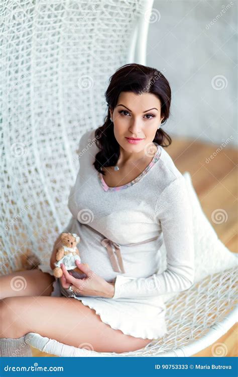 Portrait Of Beautiful Pregnant Brunette In A White Studio W Stock Image Image Of Interior