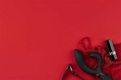 Premium Photo Black Vibrator With A Black Leather Choker Lipstick And Erotic Red Lingerie On