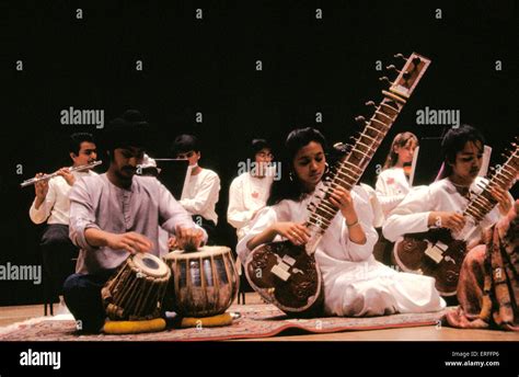indian group playing sitar tabla wearing white stock photo alamy