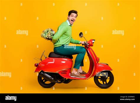 Full Size Profile Portrait Of Funny Person Sit Moped Hide Flower Behind