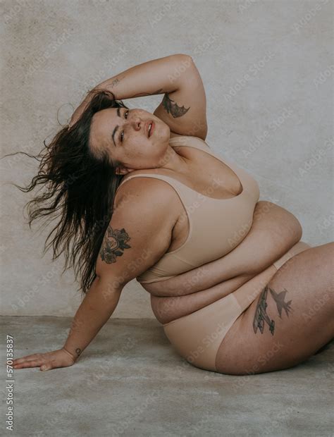 Plus Size Metis Woman Sitting On The Floor Wearing Nude Bra And Underwear Stock Photo Adobe Stock