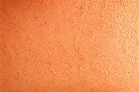 Premium Photo Peach Color And Textured Wall Background