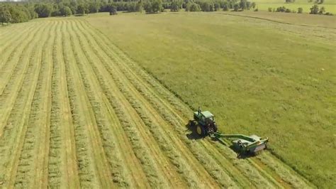 Tractor Cutting Grass In The Field · Free Stock Video