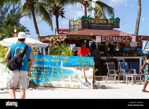 Tourists At The Colorful Beachside Tiki Bikini Hut In Nassau New Providence Island The Bahamas