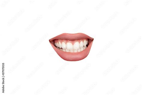 Teeth Close Up View Of Female Mouth Wearing Nude Lipstick Over White Studio Background