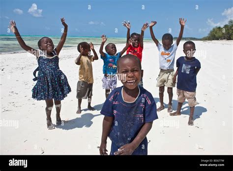 Children Playing On The Beach Zanzibar Tanzania Africa Stock Photo