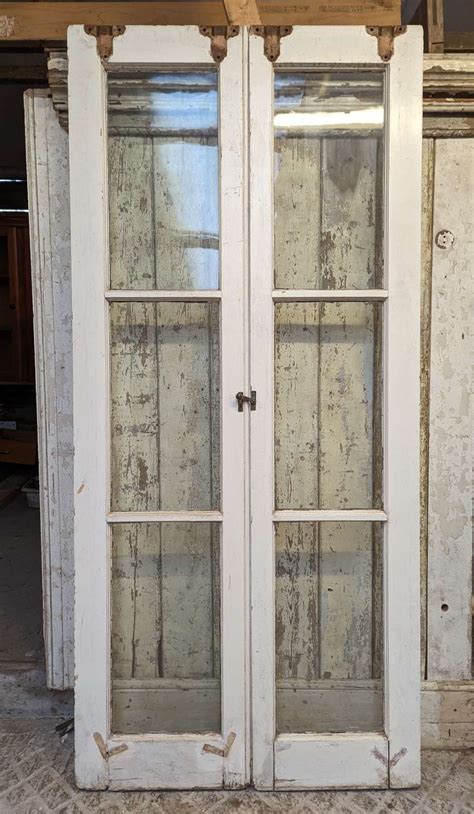 DP0484 A PAIR OF RECLAIMED PAINTED PINE INTERNAL SLIDING DOORS