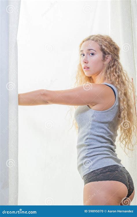 Cute Blonde Woman Standing Near Window Stock Photo Image Of