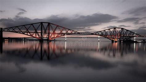 Aerial View of the Forth Bridge, Spanning a River and Illuminated with ...