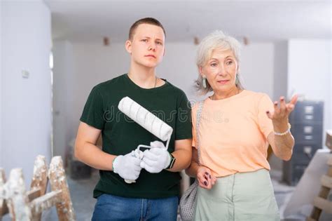 Portrait Of A Mature Woman With A Fifteen Year Old Worker Stock Photo Image Of Firstjob Adult