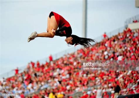 A Louisville Cardinals Cheerleader Performs During A Game Against The News Photo Getty Images