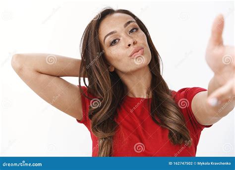Sassy Brunette Asian Girl Shows Heavy Metal Rock On Gesture Sticking Tongue And Looking