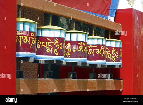 5 Buddhist prayer drums or wheels made from wood, painted bright red ...