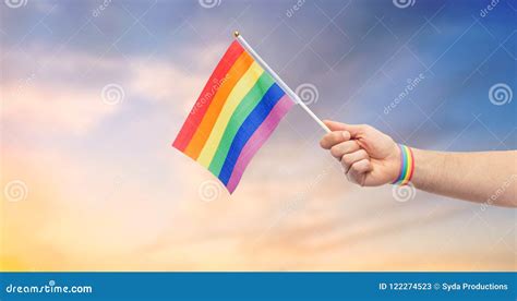 Hand With Gay Pride Rainbow Flag And Wristband Stock Image Image Of Rainbow Alternative