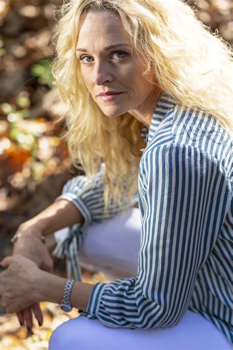 Lovely Blonde Mature Model Posing Outdoors In An Rural Environment Stock Photo Image Of