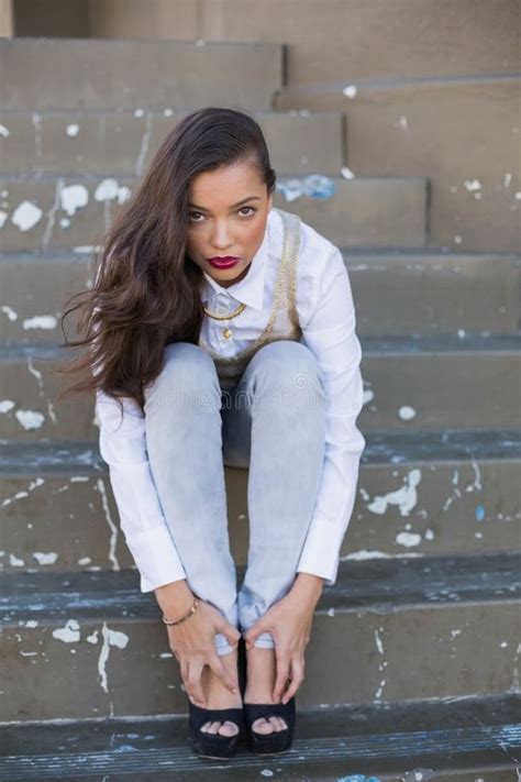 Pretty Brunette Sitting On Stairs Touching Her Feet Stock Image Image Of Concrete Long 33526737
