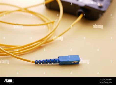 Wi Fi Router With Cables On Yellow Background Stock Photo Alamy