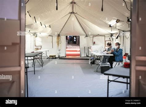Hospital Night Staff Sit At The Screening Tent Outside Of Norwegian