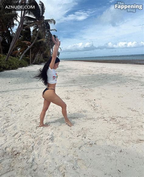 Kim Kardashian Sizzles In Sexy Beach Cartwheels Aznude