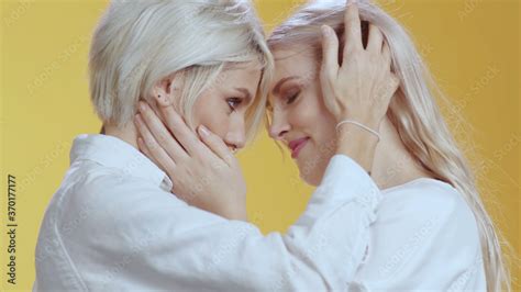 Happy Blonde Woman With Girlfriend Rubbing Her Nice Blonde Hair Embrace Gently Touch Each Other