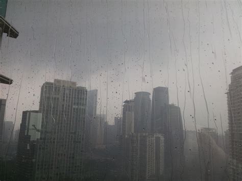 Watching the rain in Kuala Lumpur from my hotel : r/raining