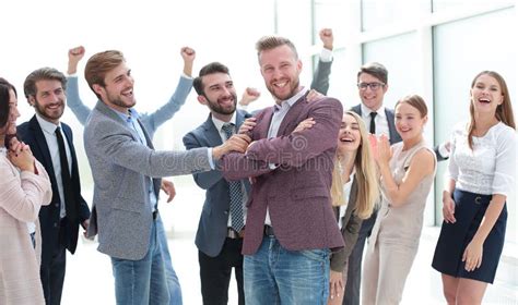 Creative Team Congratulating Their Leader Success Concept Stock Image