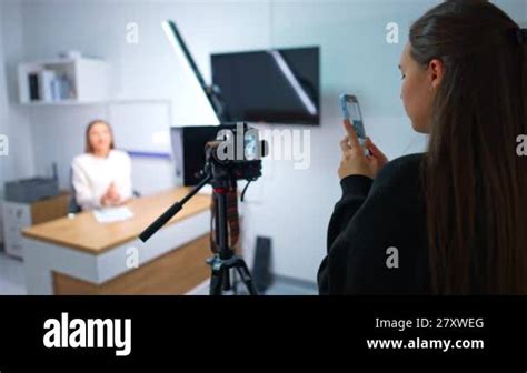 Brunette Girl Slowly Rotates Recording A Video On Her Smartphone Lady