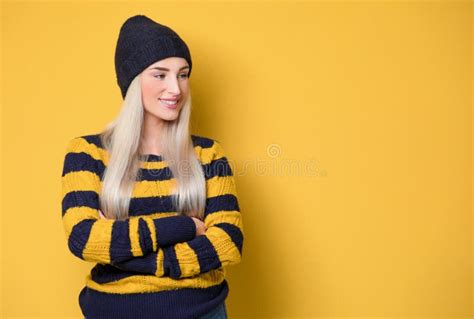 Beautiful Woman With Hands In Pockets Looking In Camera While Standing Model Wearing Woolen Cap