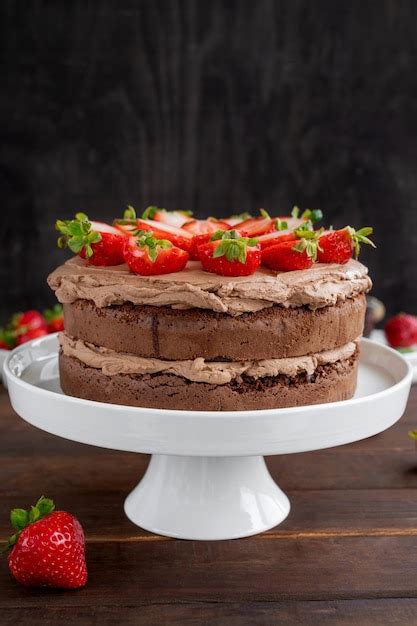 Premium Photo Naked Chocolate Cake With Cream And Fresh Strawberries On Top Rustic Style