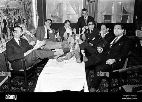 Sitting around the table are comedy writers (L-R) Denis Norden, Frank ...