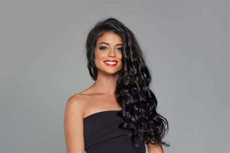 Glamorous Perfect Brunette Woman Fashion Model With Long Dark Healthy Shiny Wavy Hair Posing On