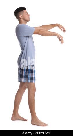 Somnambulist in pajamas on white background. Sleepwalking Stock Photo ...