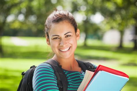 Premium Photo Casual Cheerful Student Holding Books