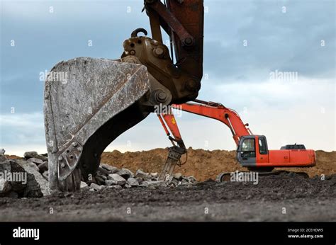 Excavator Working In A Construction Site Large Metal Iron Ladle