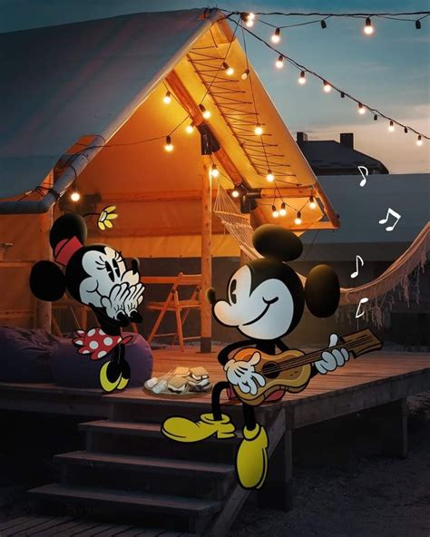 Two Mickey Mouses Are Playing The Violin And Singing In Front Of A Tent