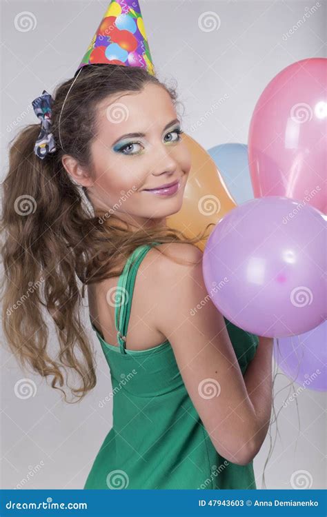 Brunette Woman In A Birthday Cap Holding Balloons And Smile Stock Image Image Of Birthday