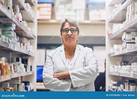 Mature Woman And Portrait Of Pharmacist In Shop With Inventory Of Drugs Pills Or Medicine