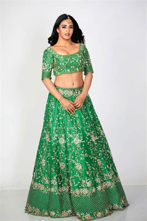 Daksha Nagarkar hot navel stills in green lehenga - South Indian Actress