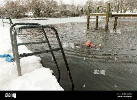 Winter Swimmers Braves The Snow And Ice For Their Daily Swim In Highgate Mens Bathing Pond