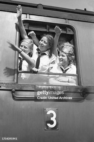BdM girls cheering oout of the window of their train taking them to ...