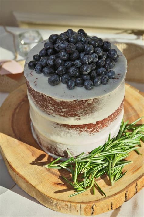 Rustic Homemade Naked Layered Wedding Cake With Vanilla Icing Fresh