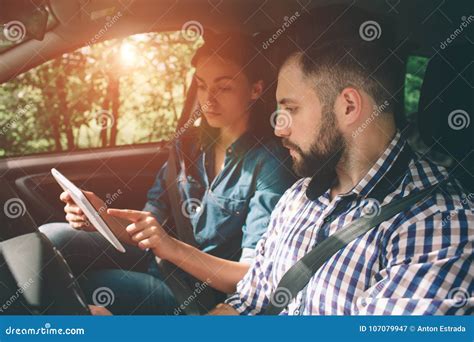 Couple Using Gps on Tablet Compter To Navigate in Car on Holiday Stock ...