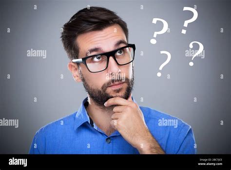 Man Thinking With Question Marks Stock Photo Alamy
