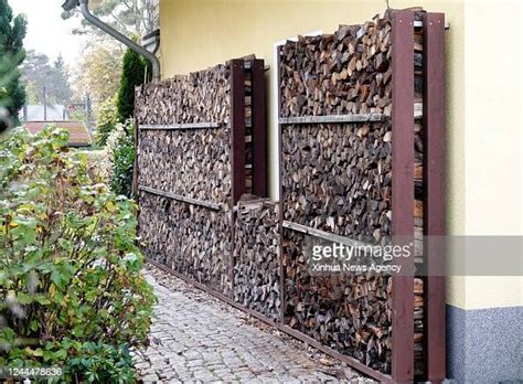 Firewood is stored outside a house in Berlin, capital of Germany ...