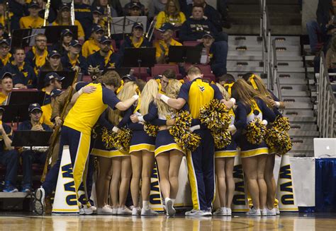 WVU cheerleaders gather before the start of the West Virginia and