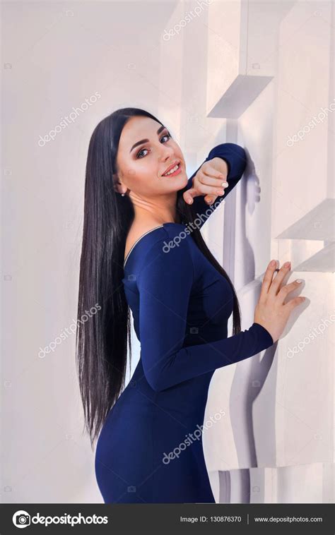 Very Beautiful Brunette With Long Hair In An Elegant Dress Stock Photo Syhinstas