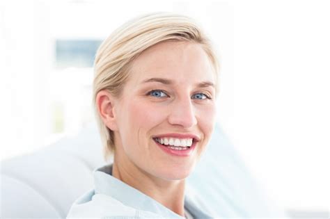 Premium Photo Pretty Blonde Woman Relaxing On The Couch And Looking At The Camera