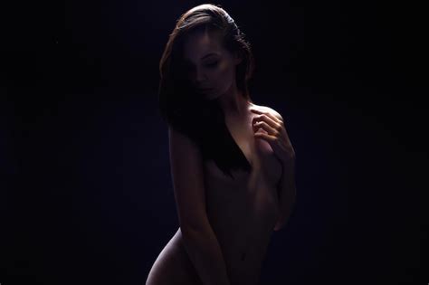 Premium Photo Nude Woman Female Silhouette Under Light In The Dark